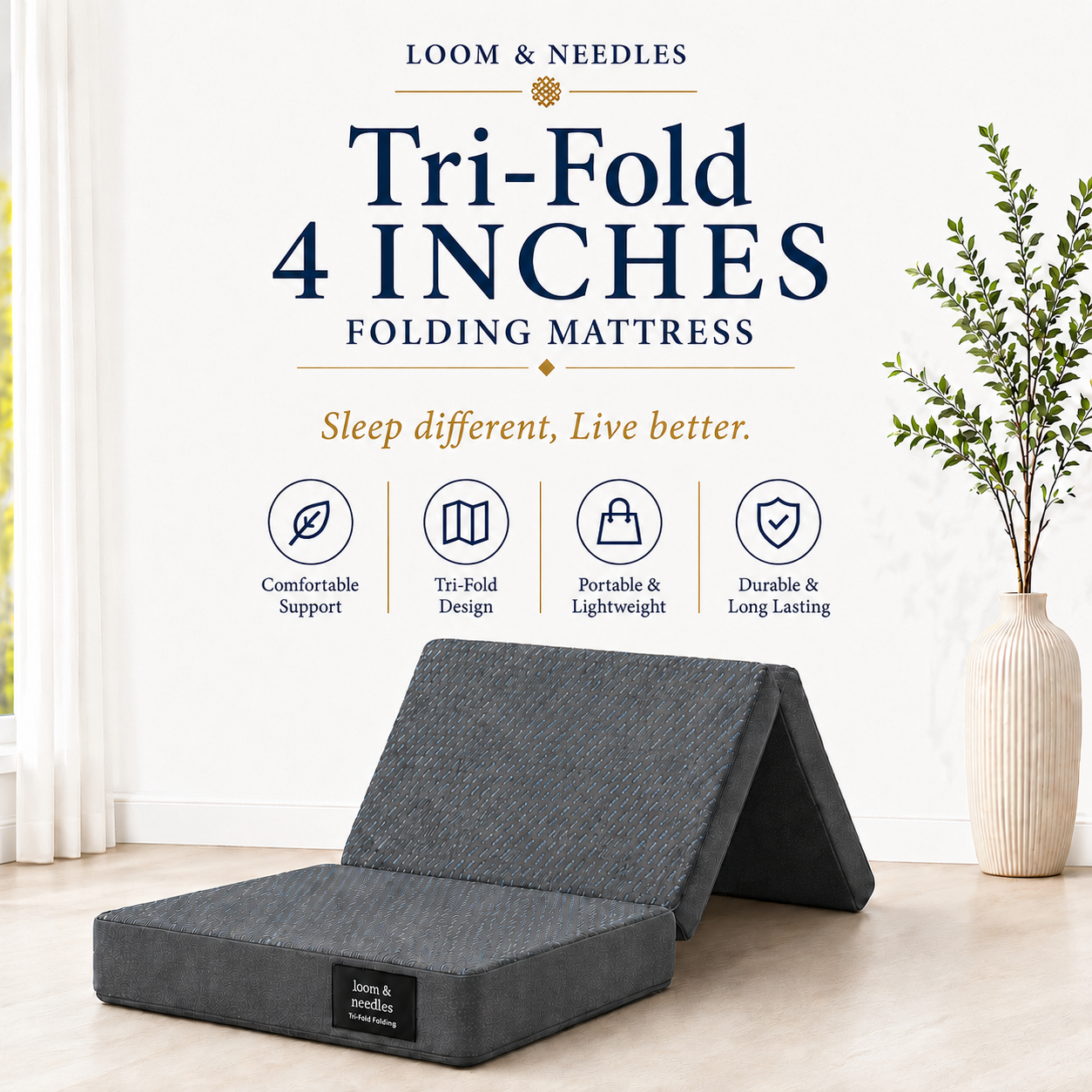A dark gray tri-fold folding mattress shown partially unfolded in a bright, modern room setting. The image includes promotional text for 'Loom & Needles' and four feature icons highlighting comfort, tri-fold design, portability, and durability.