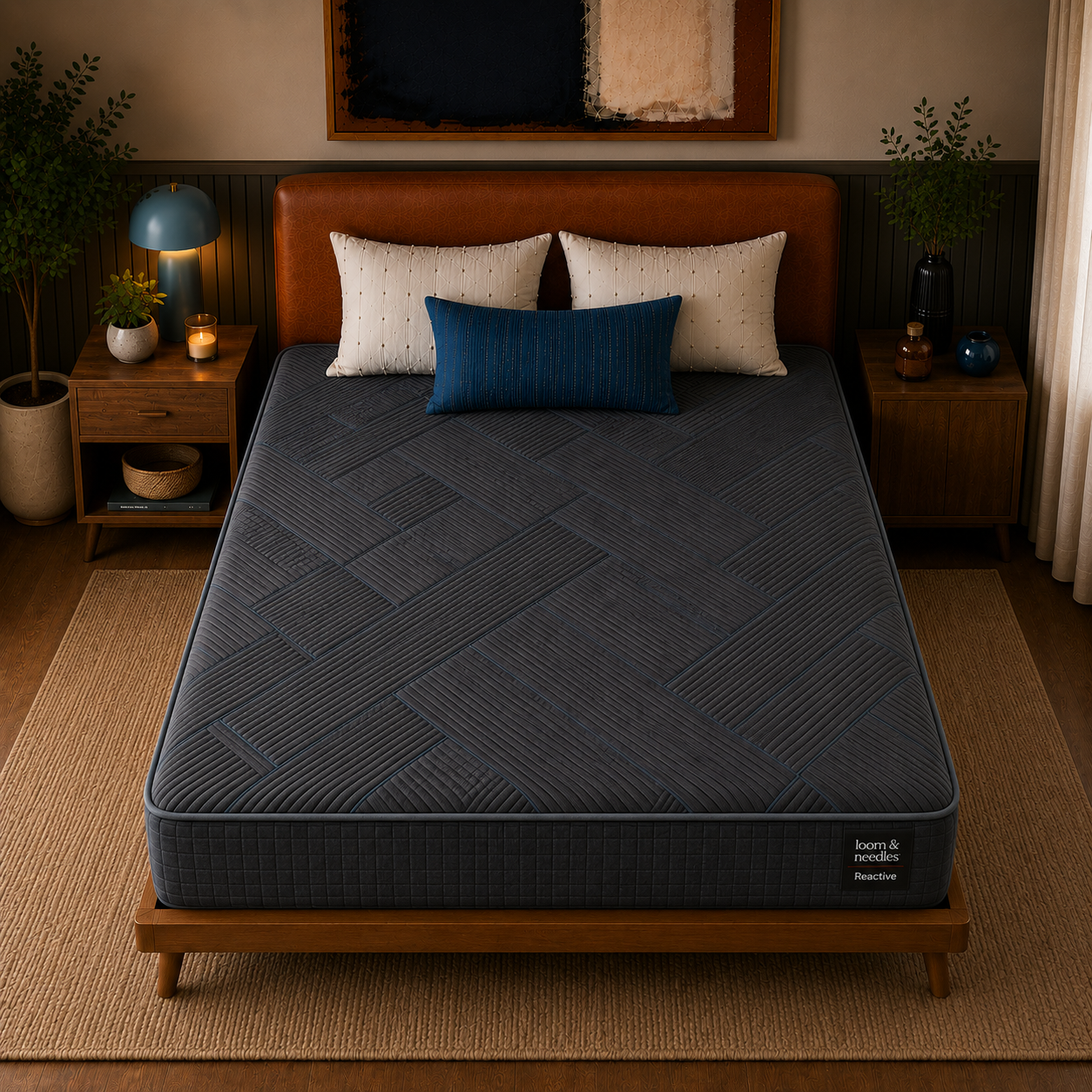 A Reactive Dual Comfort Orthopaedic Pocket Spring Mattress with a textured geometric pattern, shown on a wooden bed frame in a styled bedroom setting with a brown leather headboard, white and blue pillows, and bedside tables.